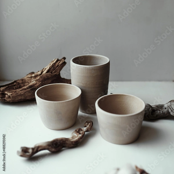 Fototapeta three gray raw ceramic cups