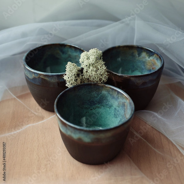 Obraz three ceramic cups in blue ocean glaze