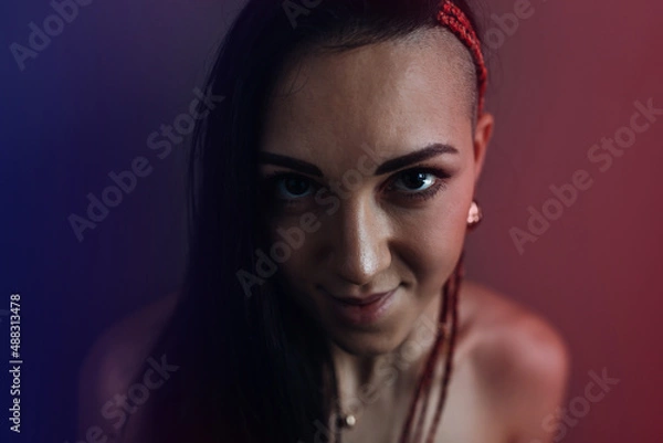 Fototapeta Portrait of an attractive woman at the darkroom