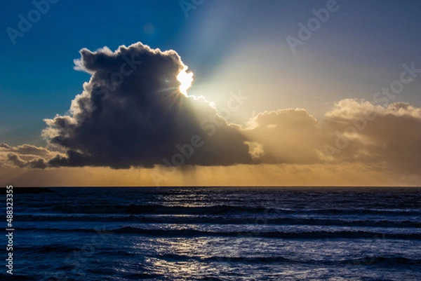 Obraz Sunset cloud formations with light rays