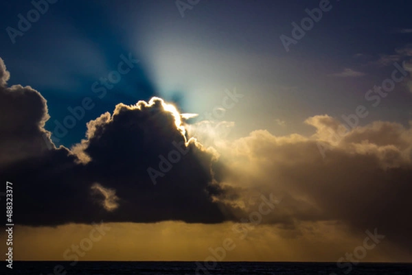 Obraz Sunset cloud formations with light rays