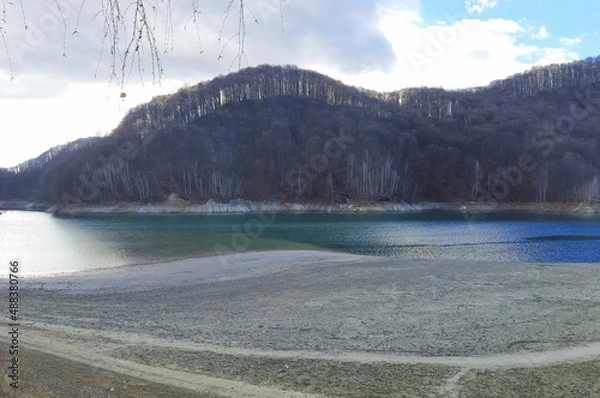 Fototapeta Amazing view of the Paltinu Lake among beautiful mountains and blue sky reflected in water in Doftana Valey (Valea Doftanei)