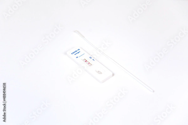Obraz Covid-19 rapid antigen test kit. Positive test result using rapid testing device for COVID-19 virus