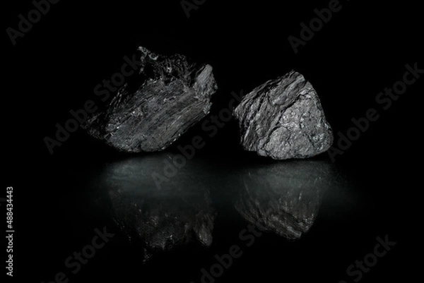 Fototapeta Coals are reflected in the glass surface. Stylish   photo for computer desktops and mobile home screens. Mineral carbon. A desktop picture. 