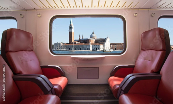 Obraz Train window with Venice landscape and empty seats.