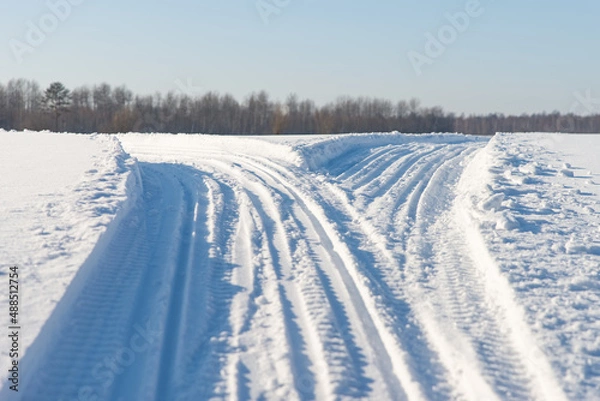 Obraz Snowmobile road close up. Winter landscape