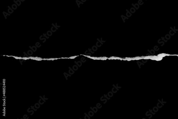 Fototapeta Paper tear, ripped paper edge, torn edge, isolated paper tear white on black, paper corner with space for copy