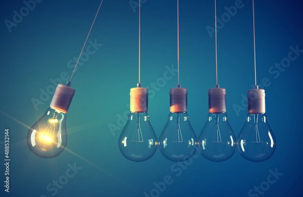 Fototapeta Newton's cradle made of light bulb.