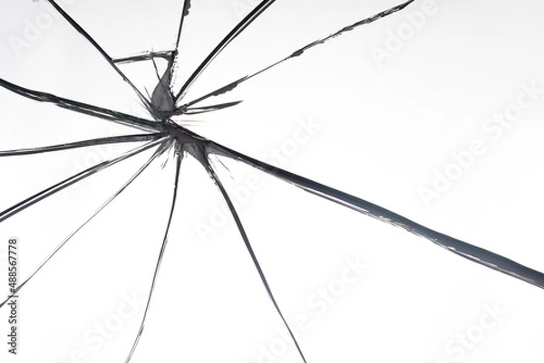 Fototapeta Broken glass close-up. Problem metaphor. White background with crack. Background on theme of breakage. Pattern with shattered mirror. Shattered background. Broken glass texture
