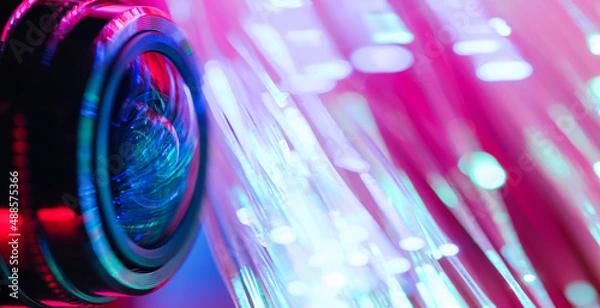 Obraz Camera lens with with multi-colored backlight. Optics. Cyberpunk style. Banner
