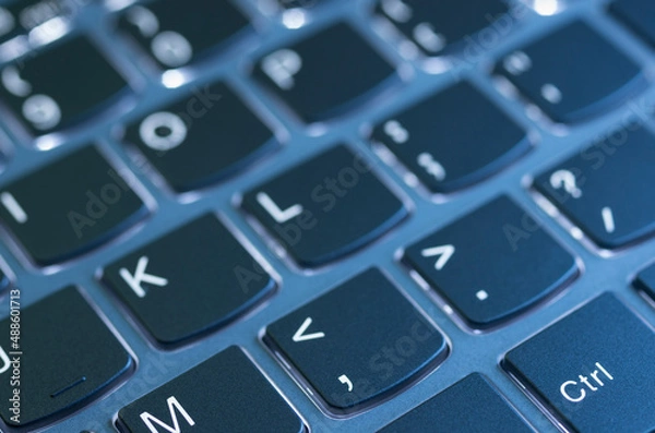 Obraz Laptop keyboard illuminated by a nice blue light