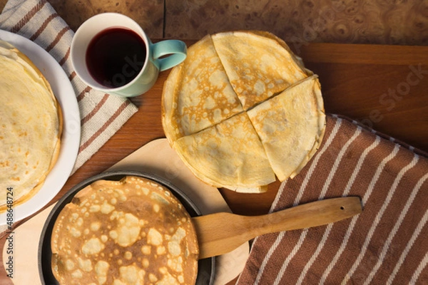 Obraz Pancake week. Preparation of dough for baking delicious and ruddy pancakes from the ingredients eggs, flour, butter and milk. Maslenitsa traditional Russian festival meal.