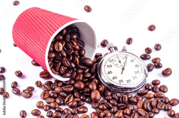 Obraz Roasted coffee beans fall out of the red cup and stopwatch, it's time to drink coffee