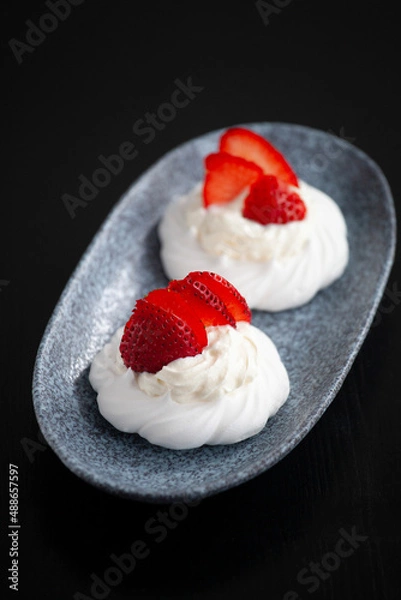 Fototapeta sweet mini cake Pavlova with strawberries whipped cream and meringue
