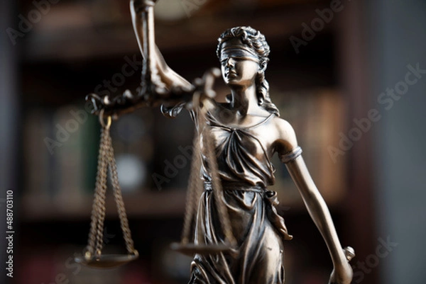 Fototapeta Judge office. Justice symbol - Themis sculpture on brown background.