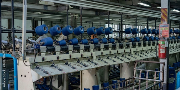 Fototapeta Garment factory machine and technology  in Bangladesh