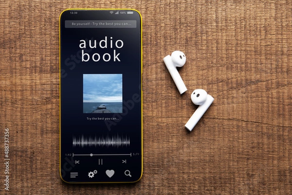 Fototapeta Streaming service. Listen audiobook online concept, online music player app on smartphone