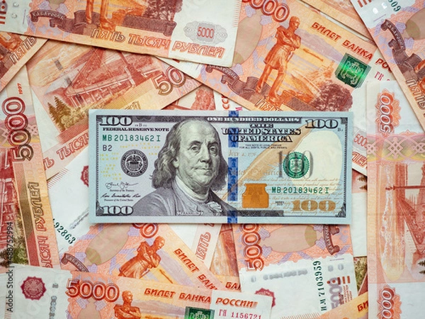 Fototapeta US Dollar and Russian ruble. Money background. Currency exhange. Economic crisis. Rouble dollar cash. Hundred dollar bill and 5000 rubles. Business and finance. Russia and USA