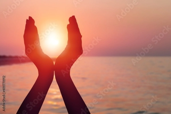 Obraz Summer sun concept with silhouette of young woman's hands relaxing, happy meditating