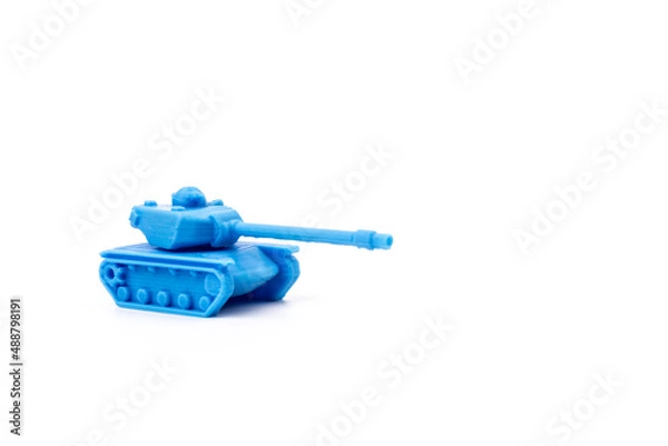 Fototapeta Toy tank of blue color. Close-up of little plastic ABS model. Blue filament. Objects printed by 3d printer Isolated on white background.