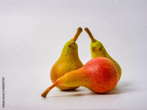 Fototapeta Green pear with a leaf isolated on white. Pear Clipping Path. Professional studio photo