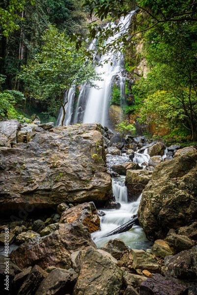 Fototapeta Amazing waterfall in green forest,The terrestrial Halaza Waterfall is in Bang Lang National Park Tham Thalu , Bannang Sata , Yala Thailand