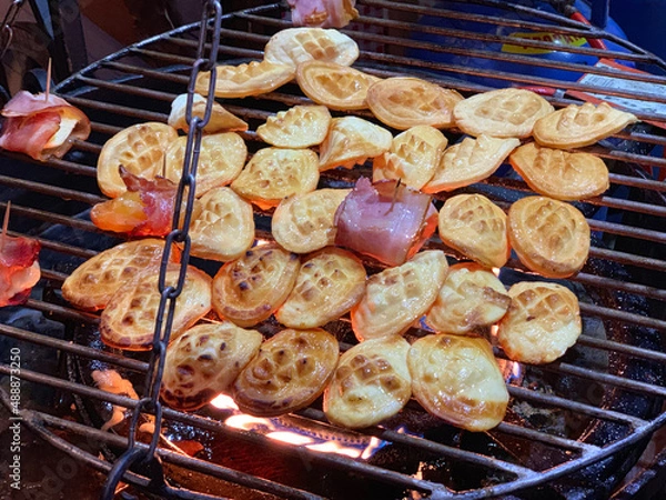 Fototapeta Traditional Polish smoked goat cheese roasted over the fire with bacon