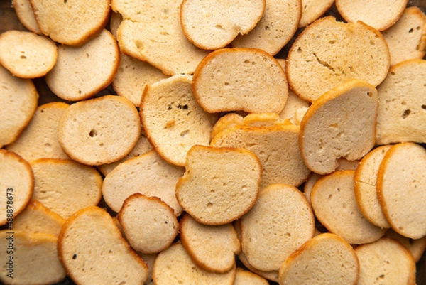 Obraz A closeup horizontal image of delicious golden toasted bagel chips.