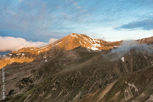 Fototapeta Golden sunlight over the peak (Peak of Bastiments, Pyrenees Mountains, Catalonia, Spain, Ulldeter)