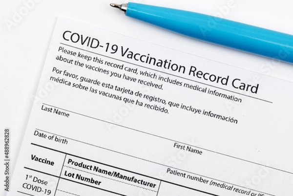 Fototapeta Covid 19 vaccination record card for individual use during the covid 19 coronavirus global pandemic - Image