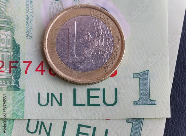 Fototapeta 1 euro coin over 1 leu RON bills