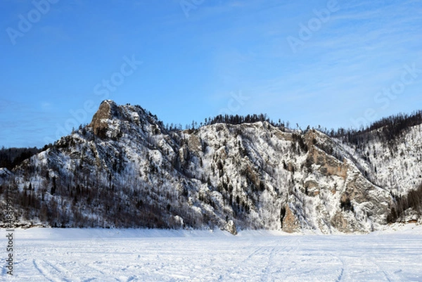 Fototapeta Snow-capped mountains. Winter view. Rocky Mountains. Harsh beauty. The nature of Siberia.