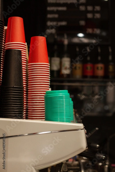 Obraz Colored paper cups for coffee on the counter