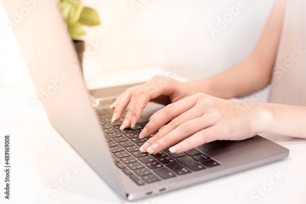 Obraz hands typing on laptop