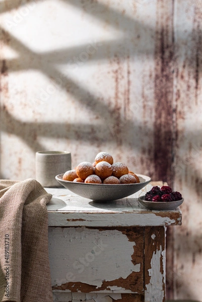 Fototapeta Fresh delicious homemade cottage cheese ball donuts with powdered sugar. Rustic style.