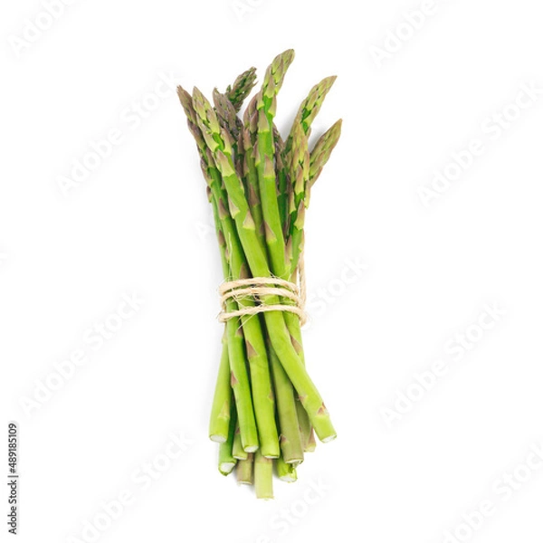 Fototapeta Delicious green spears. High angle shot of a bundle of green asparagus against a white background.