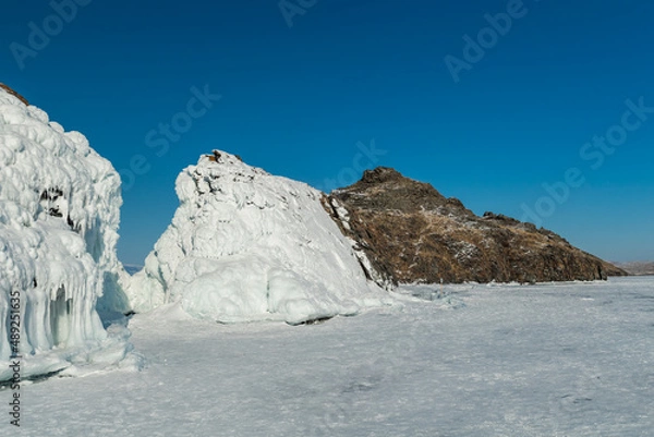 Fototapeta Island covered by ice in the middle on Baykal lake, Siberia
