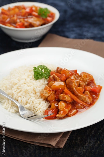Obraz Schweinefleisch süß-sauer mit Reis