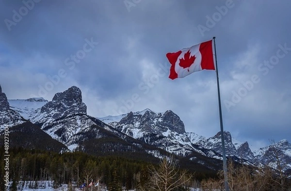 Fototapeta Canadian Flag By Mountains