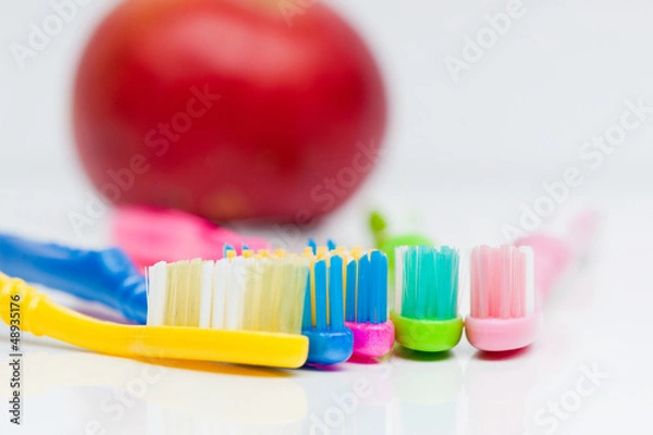 Fototapeta Toothbrushes and apple