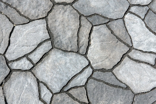 Fototapeta Close-up of garden stone block paved walkway.