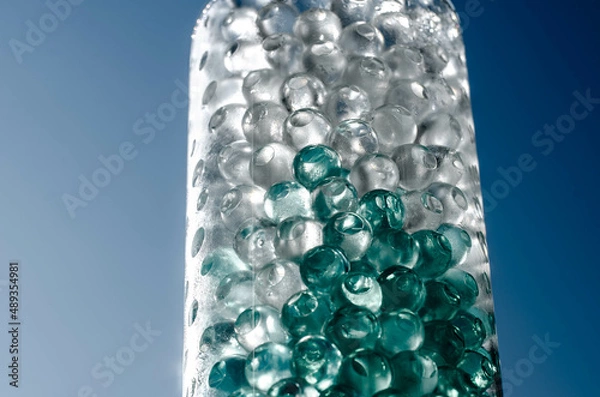 Obraz Hydrogel balls in a glass vase. Hydrogel as an art object or background for a computer desktop. Hydrogel close-up.