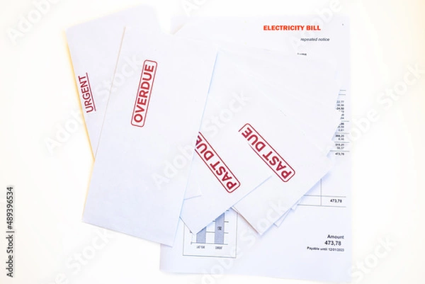 Fototapeta Electricity bill and stack of mail envelopes marked urgent, overdue, past due as price rise concept
