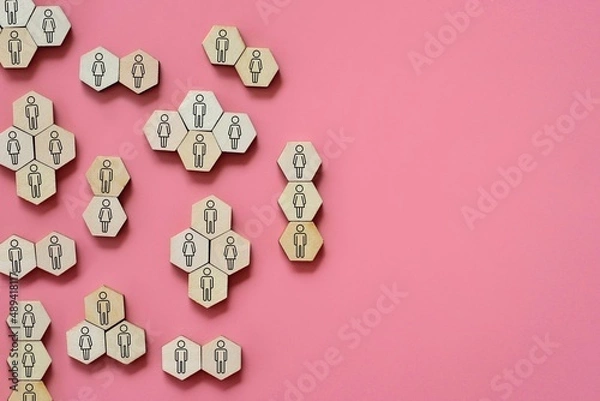 Fototapeta Mingle, discussion, chatting concept. Top view image of wooden hexagon with man and woman icon.