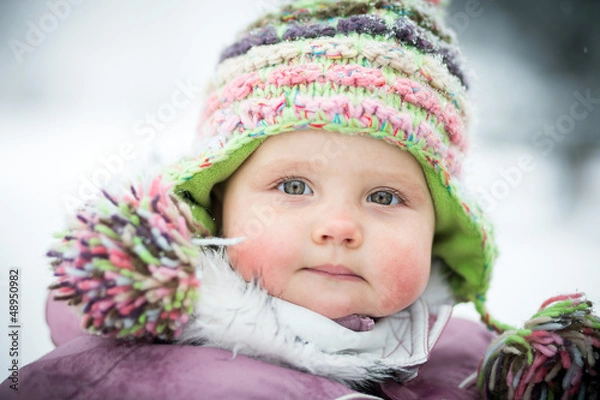 Fototapeta Happy baby on the winter background