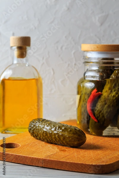 Fototapeta Pickled cucumbers in a jar.
