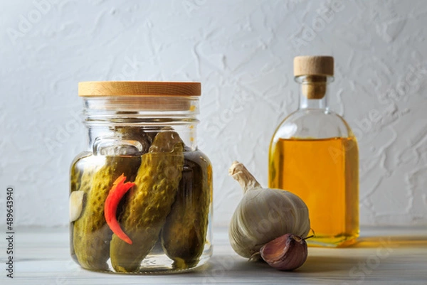 Fototapeta Pickled cucumbers in a jar.