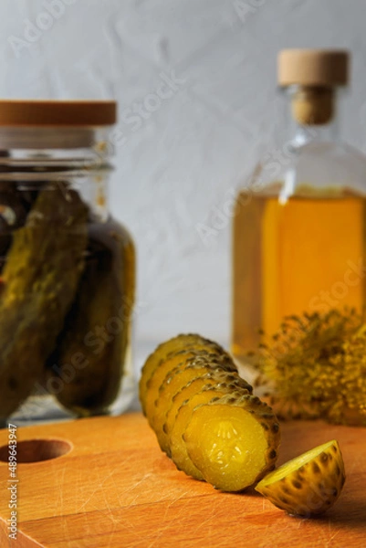 Fototapeta Pickled cucumbers in a jar.