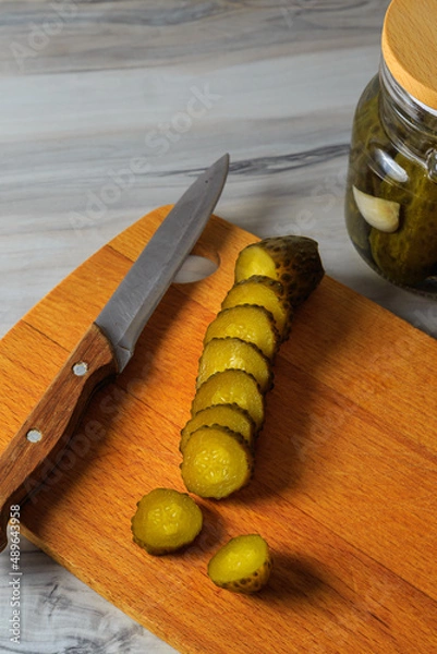 Fototapeta Pickled cucumbers in a jar.