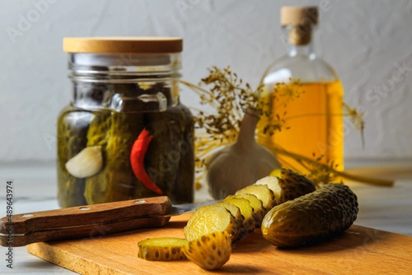 Fototapeta Pickled cucumbers in a jar.